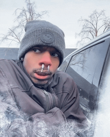 Man in Beanie With Ice Coming Out of Nose and Mouth