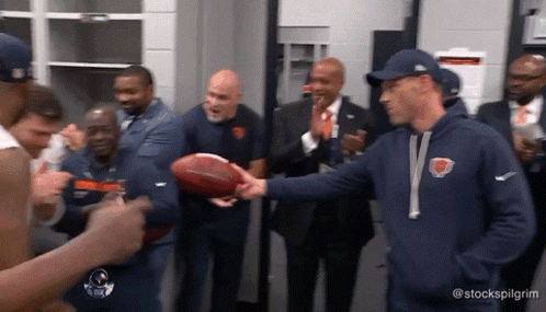 Man In Bear Sweatshirt Shaking Hands With Football Player GIF