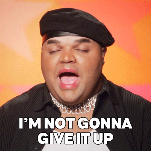 Man in Beret and Choker Saying Not Giving Up