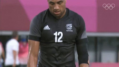 Man in Black Adidas Shirt Number 12
