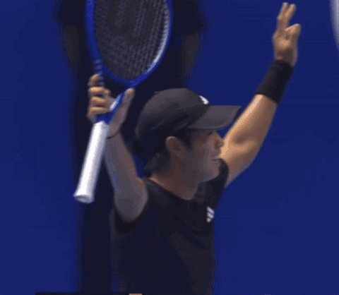 Man in Black Adidas Shirt Playing Tennis
