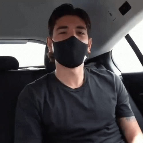 Man in Black Adidas Shirt Sitting in Car
