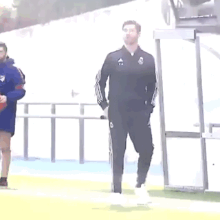 Man in Black Adidas Tracksuit on Soccer Field