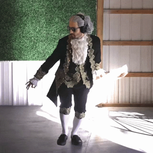 Man In Black And Gold Costume With White Socks GIF