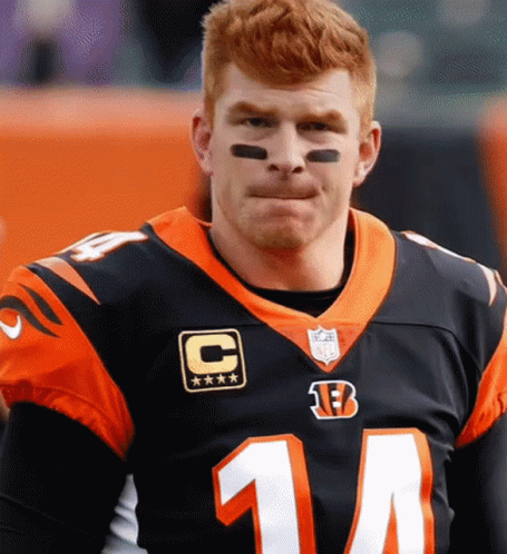 Man in Black and Orange Jersey Number 14