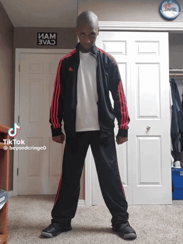 Man in Black and Red Adidas Tracksuit