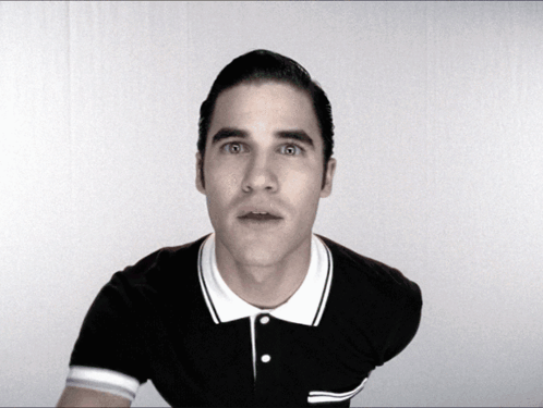 Man in Black and White Polo Shirt Surprised