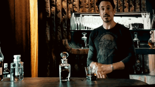 Man In Black And White Shirt At Bar GIF