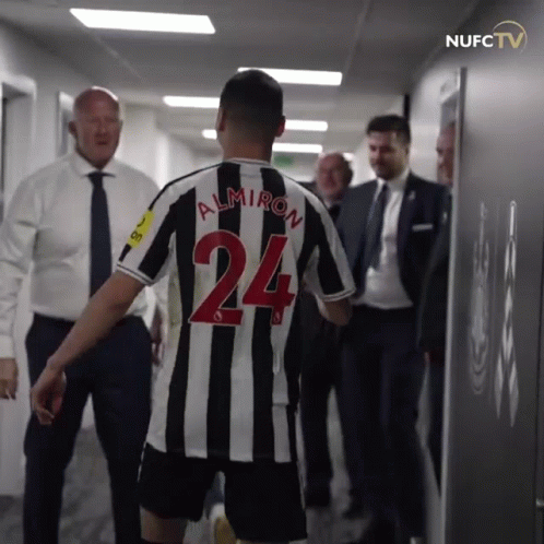 Man in Black and White Striped Jersey Number 24