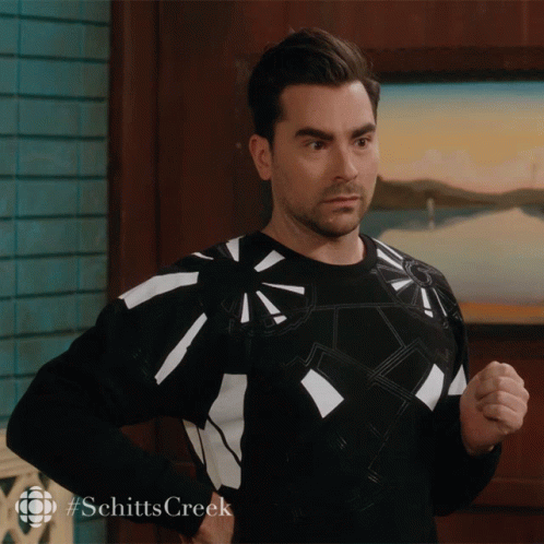 Man In Black And White Sweater With #Schitts Creek GIF