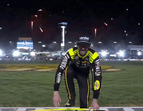 Man In Black And Yellow Outfit With Carden GIF