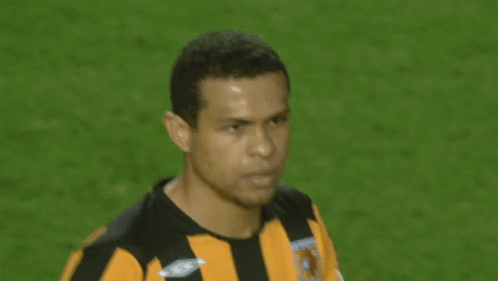 Man In Black And Yellow Striped Umbro Shirt GIF