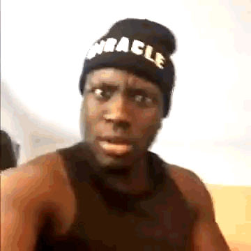 Man in Black Beanie and Tank Top Making Funny Face