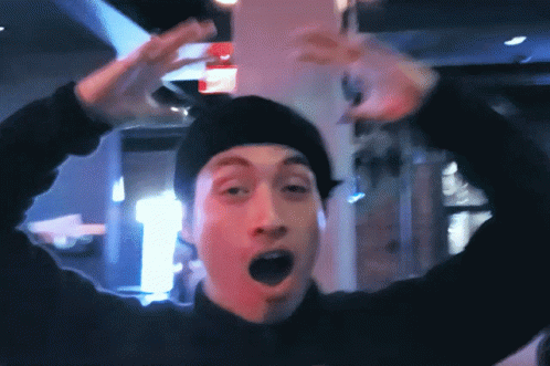 Man in Black Beanie Making Funny Face
