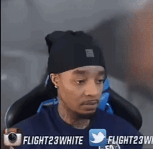 Man In Black Beanie Sitting GIF
