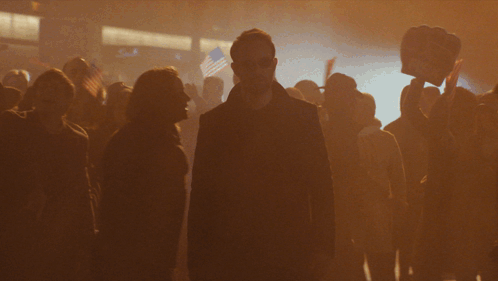 Man in Black Coat in Crowd