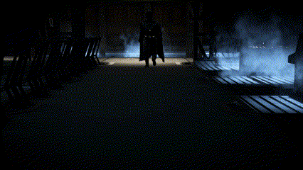 Man In Black Coat Walking In Dark GIF