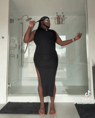 Man in Black Dress Holding Shower Head with TikTok