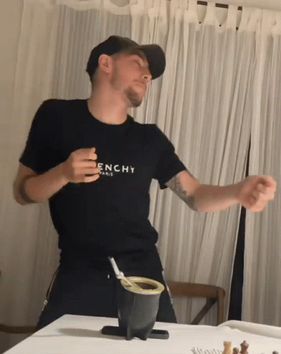 Man in Black Givenchy Shirt Dancing