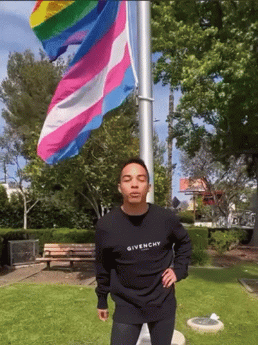 Man In Black Givenchy Sweatshirt With Rainbow Flag GIF