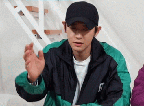 Man In Black Hat And Green Jacket With T GIF
