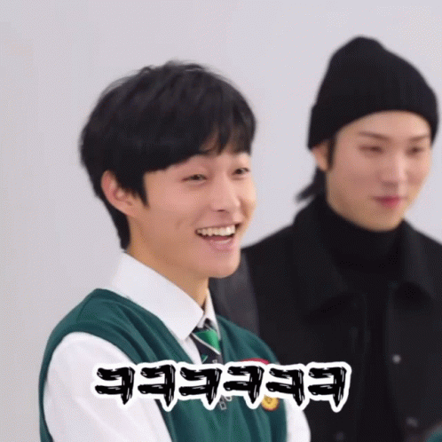 Man in Black Hat and Green Vest Saying Eeeeee