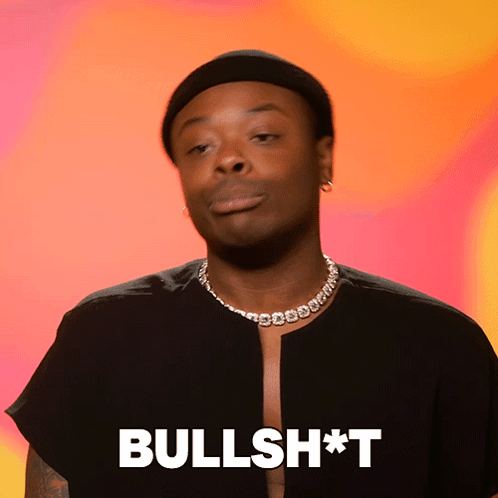 Man in Black Hat and Necklace Saying Bullshit