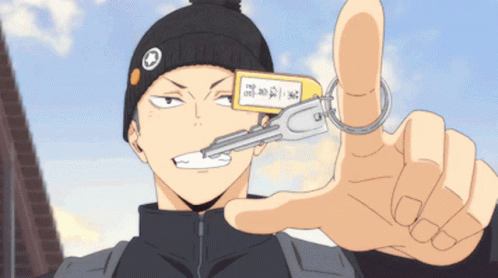 Man in Black Hat Holding Key in Mouth