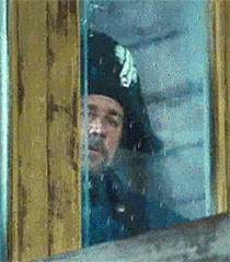 Man In Black Hat Looking Out Window GIF