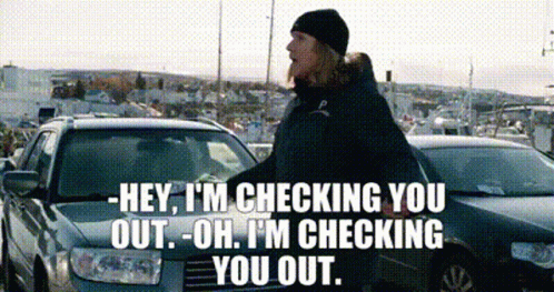 Man in Black Hat Talking to Car