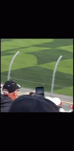 Man In Black Hat Watching Race GIF