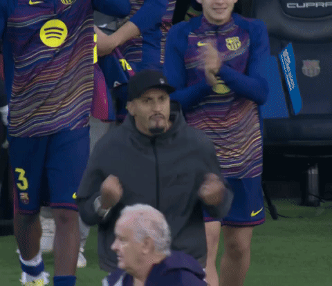 Man In Black Hat With Number 26 In Front Of Soccer Players GIF