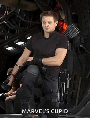 Man in Black Holding Bow Saying Marvel's Cupid