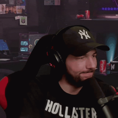 Man In Black Hollister Shirt And NY Hat GIF