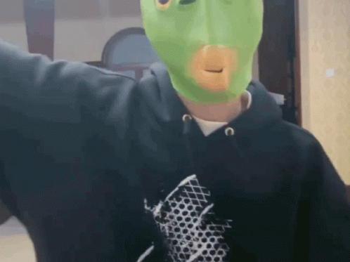 Man in Black Hoodie and Green Mask