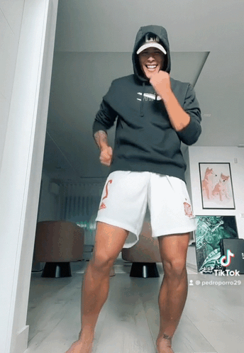 Man in Black Hoodie and White Shorts Dancing