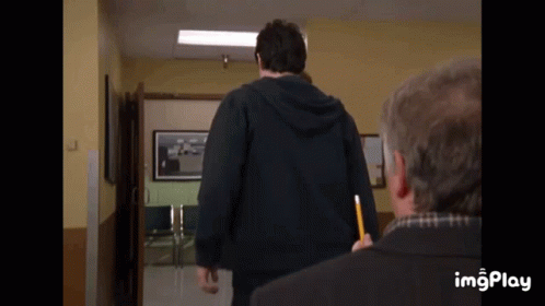Man in Black Hoodie Holding Pencil