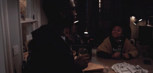 Man in Black Hoodie Holding Wine