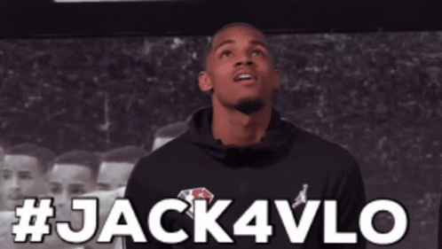 Man In Black Hoodie In Front Of Jack4Vlo Sign GIF
