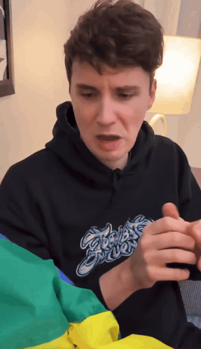 Man in Black Hoodie Saying Ghost Power