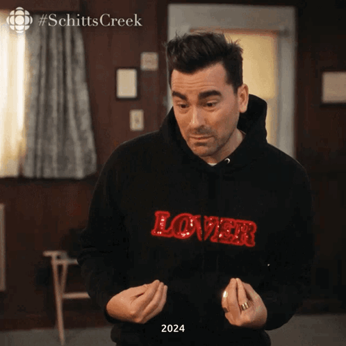 Man in Black Hoodie Saying Lover