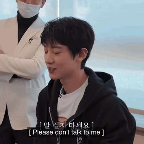Man in Black Hoodie Says Please Don't Talk to Me