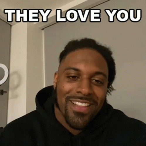 Man in Black Hoodie Smiling Saying They Love You