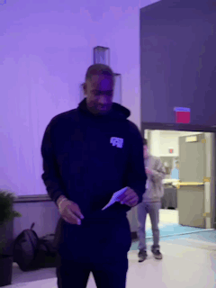Man in Black Hoodie With Letter R