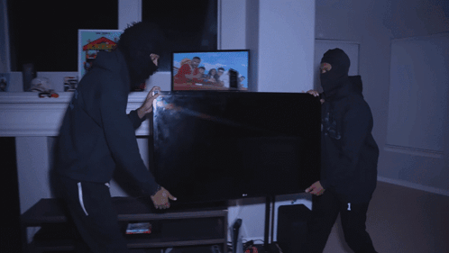 Man In Black Hoodie With Number 1 On Back GIF