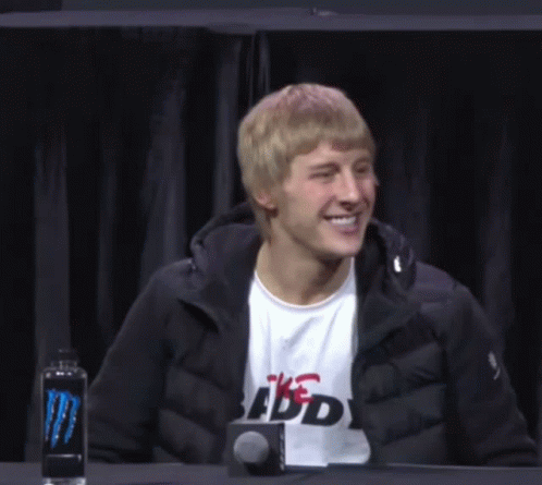 Man in Black Jacket and Budweiser Shirt