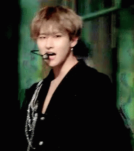 Man in Black Jacket and Earrings