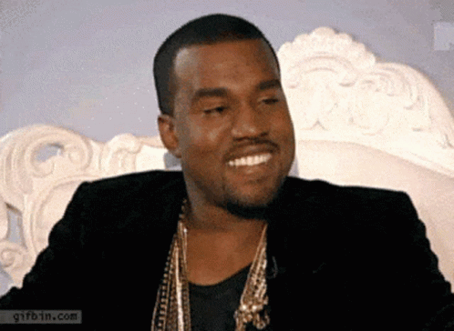 Man In Black Jacket And Gold Necklace Smiling GIF