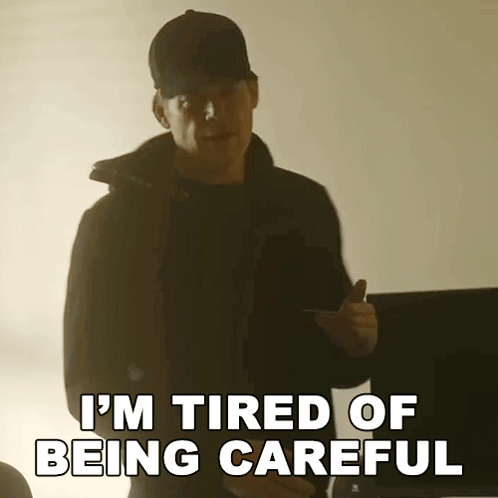 Man in Black Jacket and Hat Says I'm Tired of Being Careful