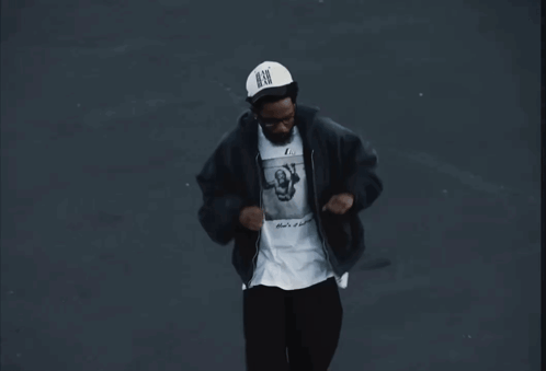 Man in Black Jacket and N.B.G. Hat